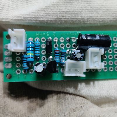 protoype-style circuit board with resistors, capacitors, and three xhr sockets